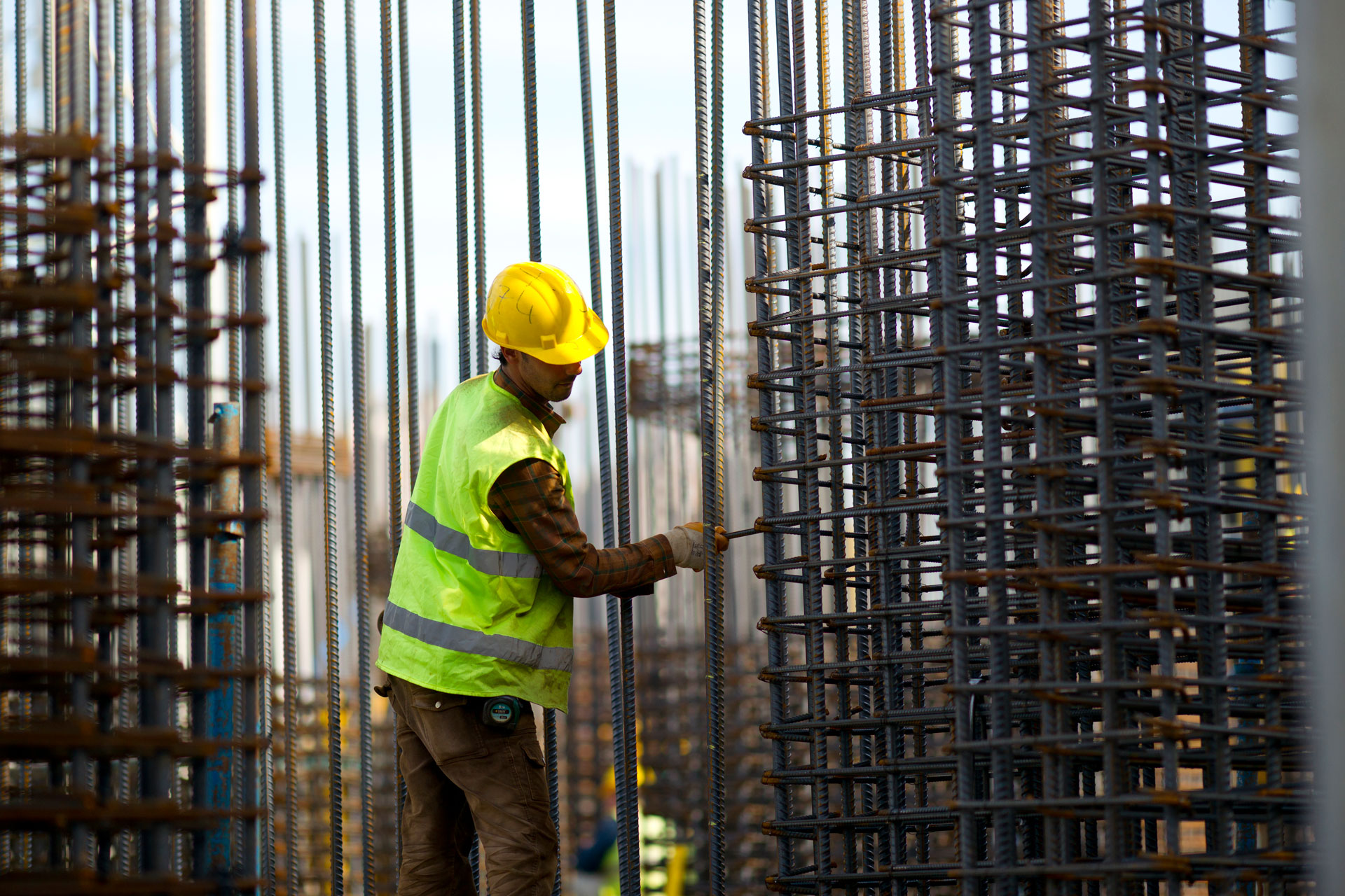 Professional building construction company in Dubai managing a modern construction project with engineers, plans, and site work